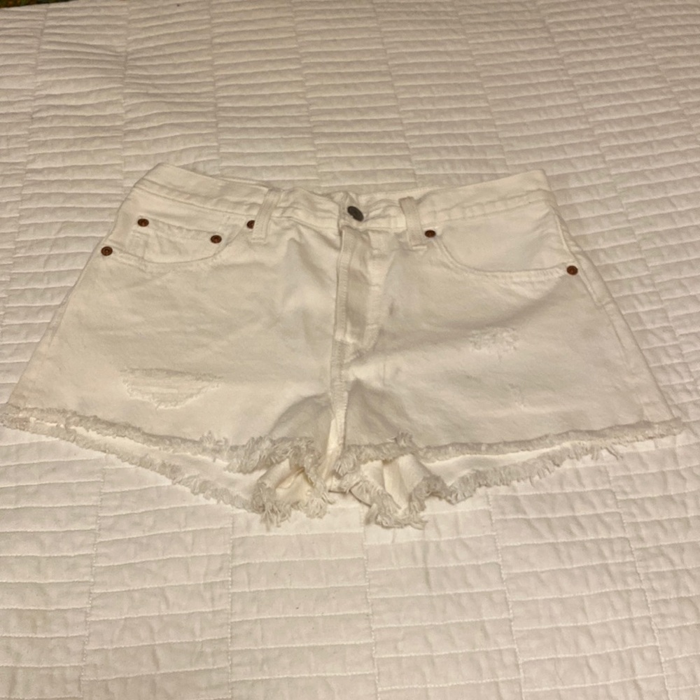 Levi’s white distressed 501 button fly shorts